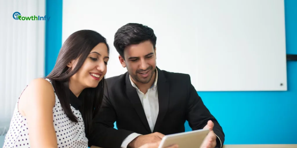 A couple reviewing financial documents and planning their future at home.
